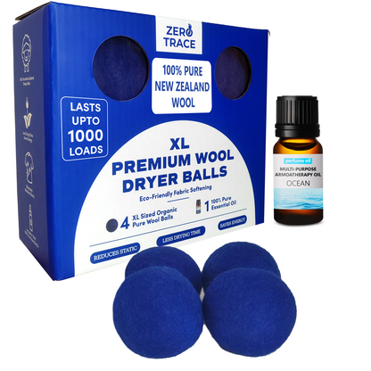 A box of XL Premium Wool Dryer Balls by Zero Trace features three blue wool balls and a small bottle of "Ocean" aromatherapy oil, serving as eco-friendly, reusable fabric softeners that infuse your laundry with a refreshing scent.